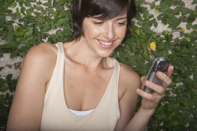 Hispanic woman on cell phone